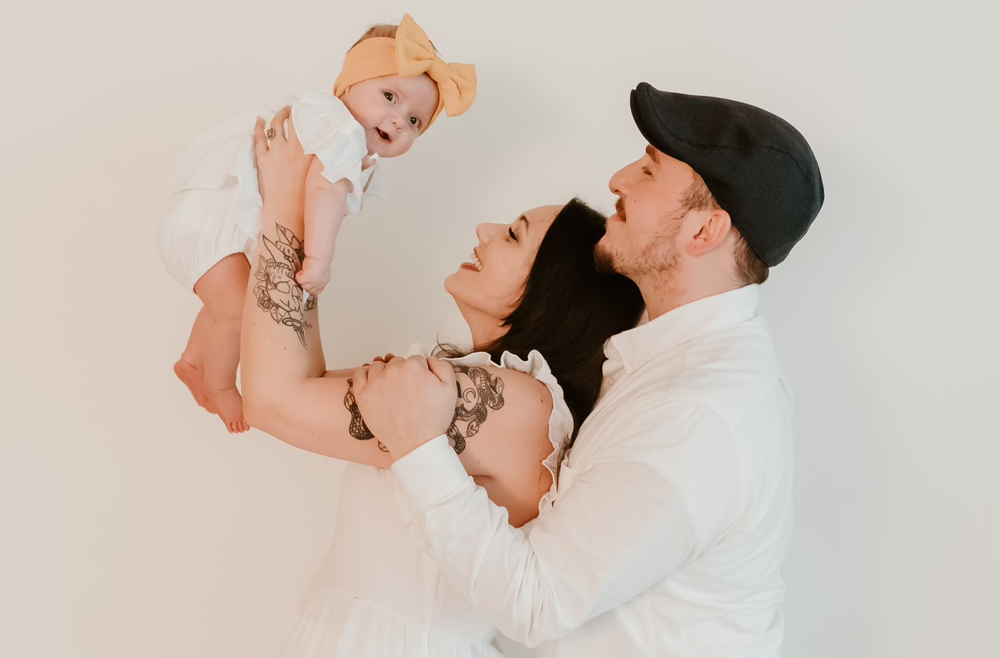 Peer Recovery Specialist Eric Ezzi poses with his wife, Nicole, and their daughter, stepdaughter and stepson, pose together on their wedding day.